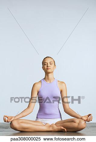 Woman sitting on floor in lotus position View Large Photo Image Stock Photography - Woman sitting on floor in lotus position. Fotosearch