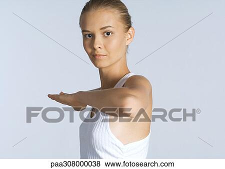 Woman with arm bent in front of chest View Large Photo Image Stock Photo - Woman with arm bent in front of chest. Fotosearch