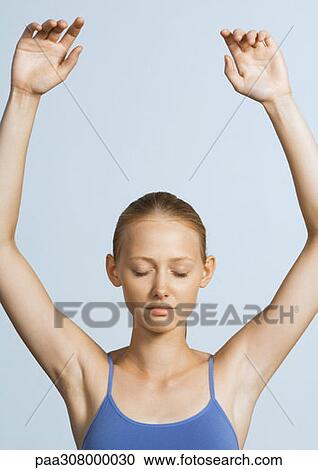 Woman with eyes closed and arms raised View Large Photo Image Stock Image - Woman with eyes closed and arms raised. Fotosearch