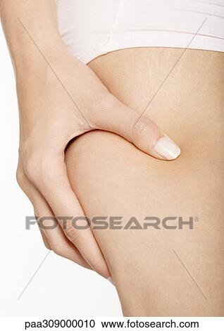 Woman squeezing thigh, close-up View Large Photo Image Stock Image - Woman squeezing thigh, close-up. Fotosearch