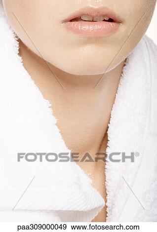 Woman's lower face and neck with towel around shoulders View Large Photo Image Stock Photo - Woman's lower face and neck with towel around shoulders. Fotosearch
