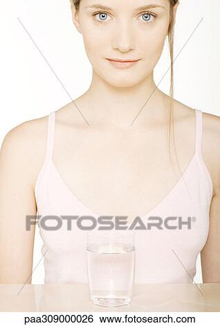 Young woman drinking glass of water View Large Photo Image Stock Photograph - Young woman drinking glass of water. Fotosearch