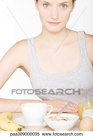 Young woman with large breakfast View Large Photo Image Stock Photography - Young woman with large breakfast. Fotosearch