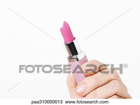 Hand holding lipstick View Large Photo Image Stock Image - Hand holding lipstick. Fotosearch