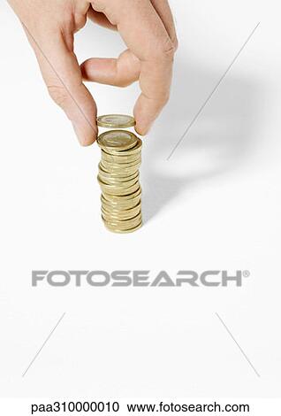 Hand stacking coins View Large Photo Image Stock Image - Hand stacking coins. Fotosearch