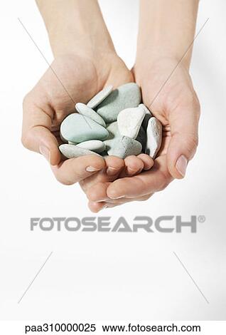 Hands holding out pebbles View Large Photo Image Stock Photography - Hands holding out pebbles. Fotosearch