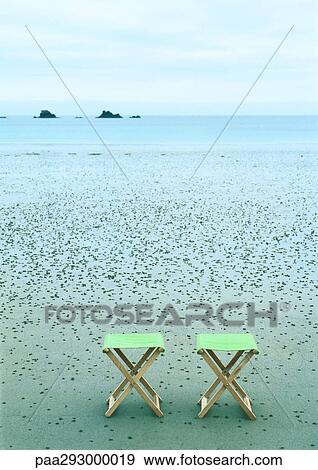 Campstools on beach View Large Photo Image Stock Photo - Campstools on beach. Fotosearch