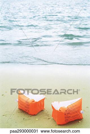 Floaties on beach View Large Photo Image Stock Image - Floaties on beach. Fotosearch