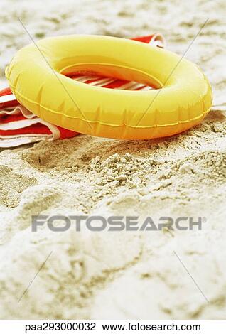 Innertube on beach View Large Photo Image Stock Image - Innertube on beach. Fotosearch
