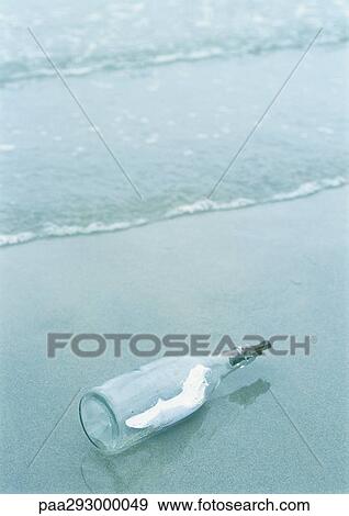 Message in a bottle washed up on beach View Large Photo Image Stock Photo - Message in a bottle washed up on beach. Fotosearch