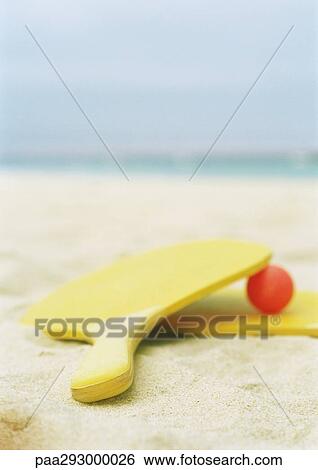 Paddleball set on beach View Large Photo Image Stock Photograph - Paddleball set on beach. Fotosearch