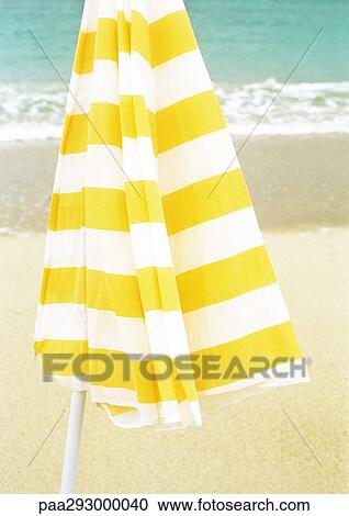 Parasol on beach View Large Photo Image Stock Image - Parasol on beach. Fotosearch