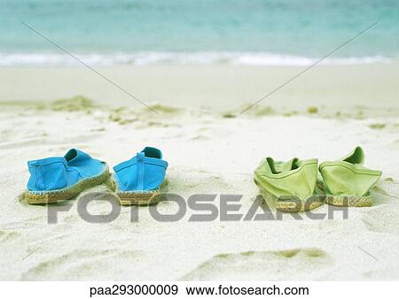 Two pairs of espadrilles on beach View Large Photo Image Stock Photo - Two pairs of espadrilles on beach. Fotosearch