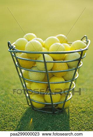 Basket of yellow golf balls View Large Photo Image Stock Image - Basket of yellow golf balls. Fotosearch