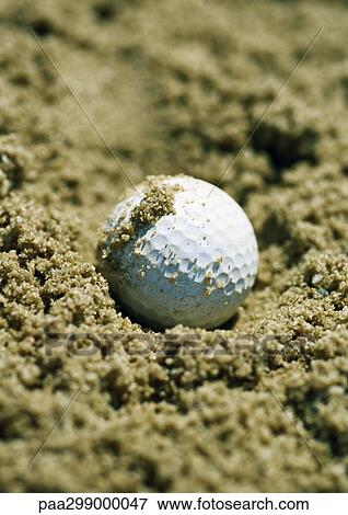 Golf ball in sand trap, close-up View Large Photo Image Stock Photo - Golf ball in sand trap, close-up. Fotosearch