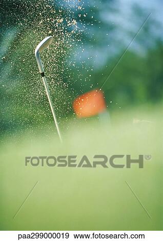Golf club and sand in mid air View Large Photo Image Stock Photo - Golf club and sand in mid air. Fotosearch