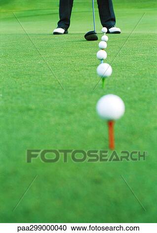 Golfer on driving range, low section View Large Photo Image Stock Image - Golfer on driving range, low section. Fotosearch