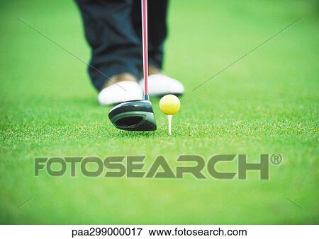 Golfer preparing to tee off, low section View Large Photo Image Stock Photo - Golfer preparing to tee off, low section. Fotosearch