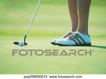 Golfer putting, low section View Large Photo Image Stock Photography - Golfer putting, low section. Fotosearch