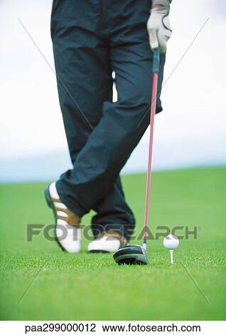 Golfer standing next to teed golf ball, low section View Large Photo Image Stock Image - Golfer standing next to teed golf ball, low section. Fotosearch