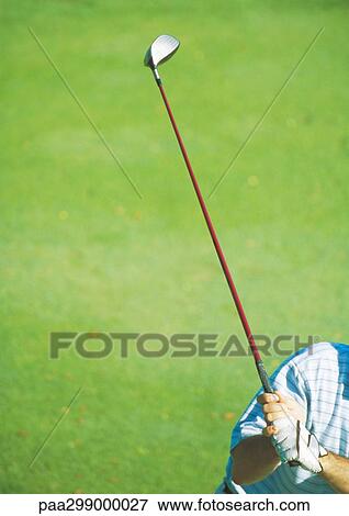 Golfer swinging club, partial view View Large Photo Image Stock Photo - Golfer swinging club, partial view. Fotosearch