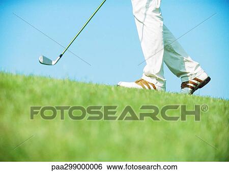 Golfer walking, low section View Large Photo Image Stock Photograph - Golfer walking, low section. Fotosearch