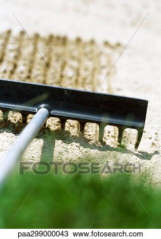 Rake on sand trap, close-up View Large Photo Image Stock Image - Rake on sand trap, close-up. Fotosearch