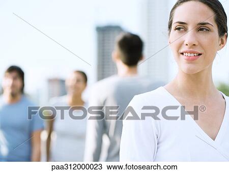 Young woman looking into distance, in urban setting View Large Photo Image Stock Image - Young woman looking into distance, in urban setting. Fotosearch