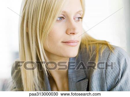Blond businesswoman looking away, portrait View Large Photo Image Stock Image - Blond businesswoman looking away, portrait. Fotosearch