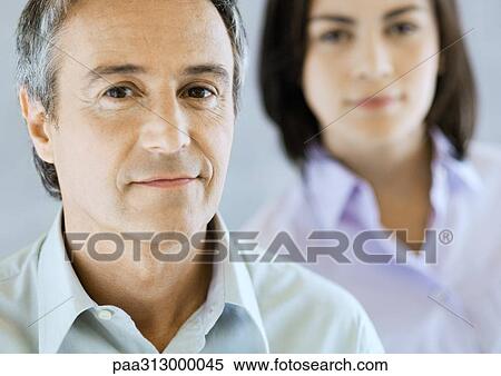 Businessman and co-worker, portrait View Large Photo Image Stock Photography - Businessman and co-worker, portrait. Fotosearch