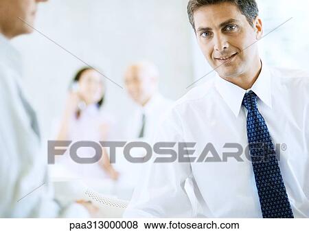 Businessman in office View Large Photo Image Stock Photo - Businessman in office. Fotosearch