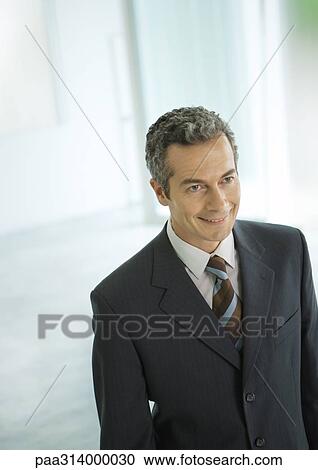 Businessman smiling, portrait View Large Photo Image Stock Image - Businessman smiling, portrait. Fotosearch