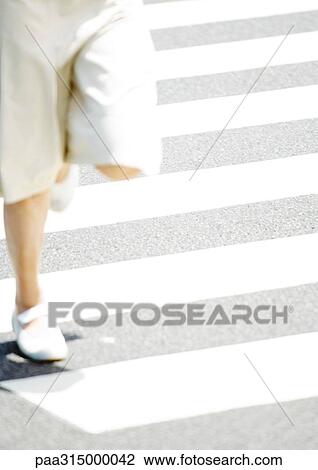 Woman crossing street, low section View Large Photo Image Stock Image - Woman crossing street, low section. Fotosearch