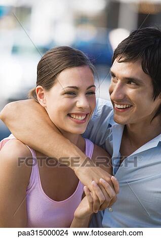 Young couple laughing View Large Photo Image Picture - Young couple laughing. Fotosearch