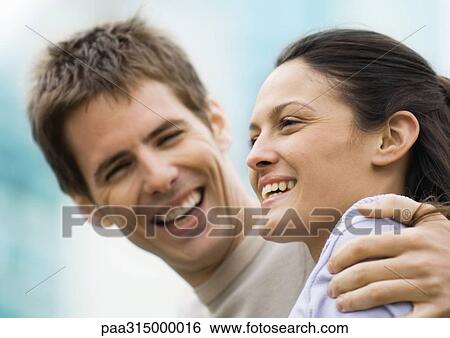 Young couple laughing View Large Photo Image Stock Photograph - Young couple laughing. Fotosearch