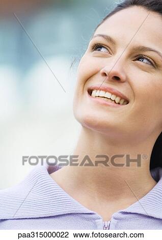 Young woman smiling View Large Photo Image Stock Image - Young woman smiling. Fotosearch