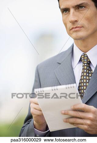 Businessman taking notes View Large Photo Image Stock Photo - Businessman taking notes. Fotosearch