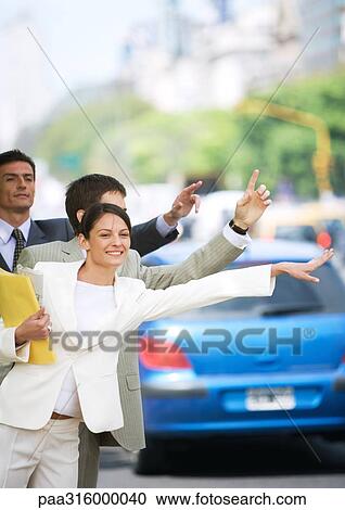 Businesspeople hailing cabs View Large Photo Image Stock Image - Businesspeople hailing cabs. Fotosearch