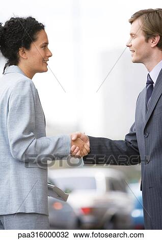 Businesswoman and man shaking hands View Large Photo Image Stock Image - Businesswoman and man shaking hands. Fotosearch