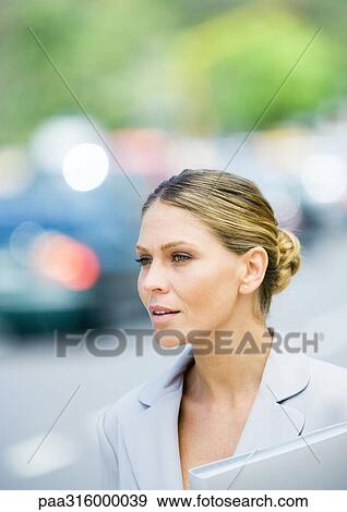 Businesswoman with file folder View Large Photo Image Stock Photo - Businesswoman with file folder. Fotosearch