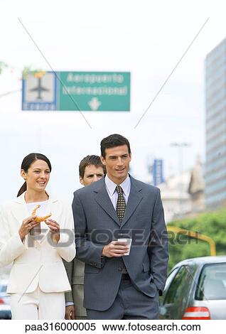 Group of business associates walking with coffees View Large Photo Image Stock Photography - Group of business associates walking with coffees. Fotosearch