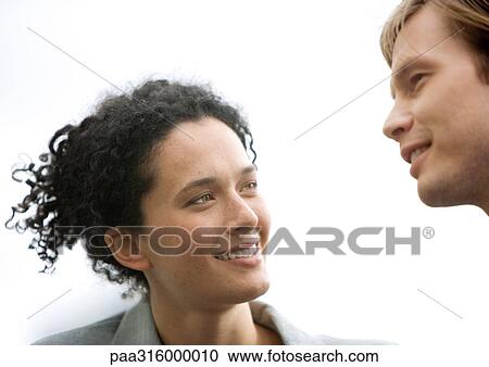 Stock Image - Woman and man conversing. Fotosearch
