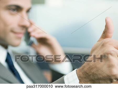 Businessman giving thumbs-up View Large Photo Image Stock Image - Businessman giving thumbs-up. Fotosearch