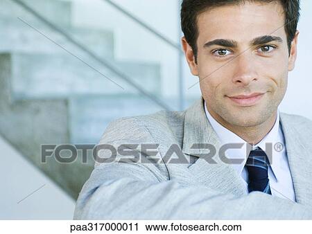 Businessman smiling, portrait View Large Photo Image Stock Image - Businessman smiling, portrait. Fotosearch