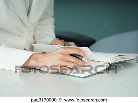 Businesswoman with agenda View Large Photo Image Stock Photo - Businesswoman with agenda. Fotosearch
