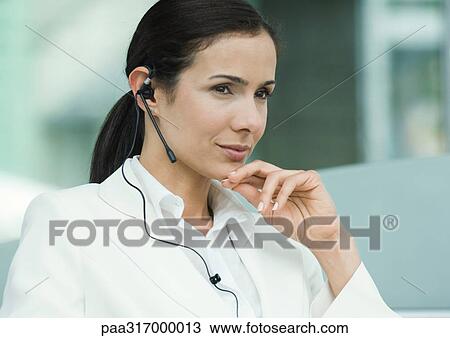 Woman wearing headset View Large Photo Image Stock Image - Woman wearing headset. Fotosearch