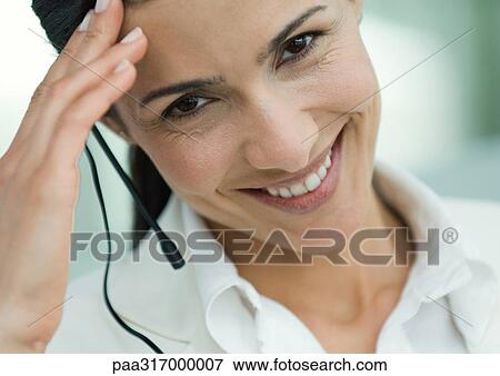 Woman wearing headset View Large Photo Image Stock Photo - Woman wearing headset. Fotosearch