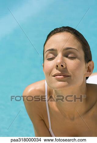 Woman leaning head back and closing eyes, close-up View Large Photo Image Picture - Woman leaning head back and closing eyes, close-up. Fotosearch