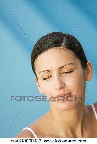 Woman's face with eyes closed, pool in background View Large Photo Image Stock Image - Woman's face with eyes closed, pool in background. Fotosearch