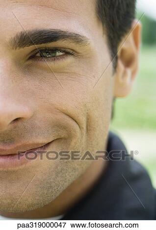 Young man smiling, cropped, portrait View Large Photo Image Stock Photo - Young man smiling, cropped, portrait. Fotosearch